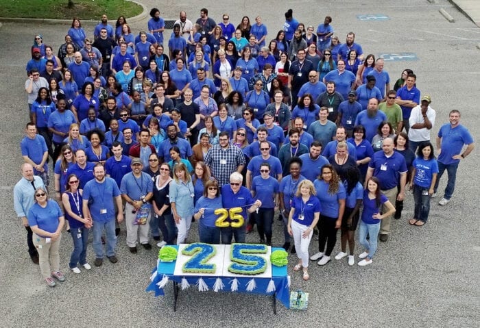 The Braille Works team standing outside at the 25th anniversary celebration