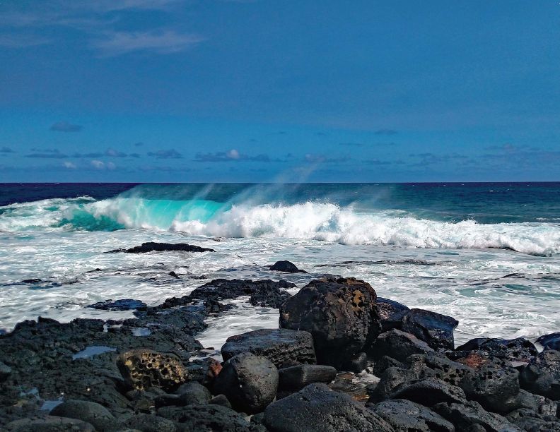 November 2027, Cashing waves on a rocky beach